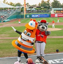 Safety Sam and Dinger at Rivercats game