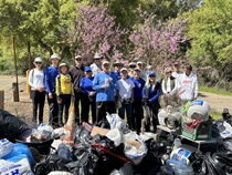 Volunteers display litter collected from Sacramento River cleanup