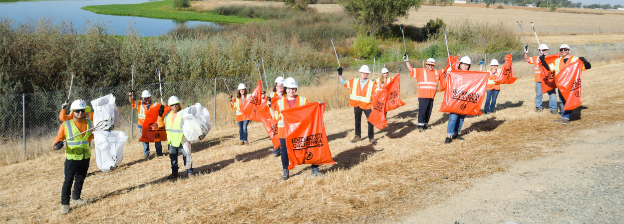 Photo of Caltrans workers cleaning up trash